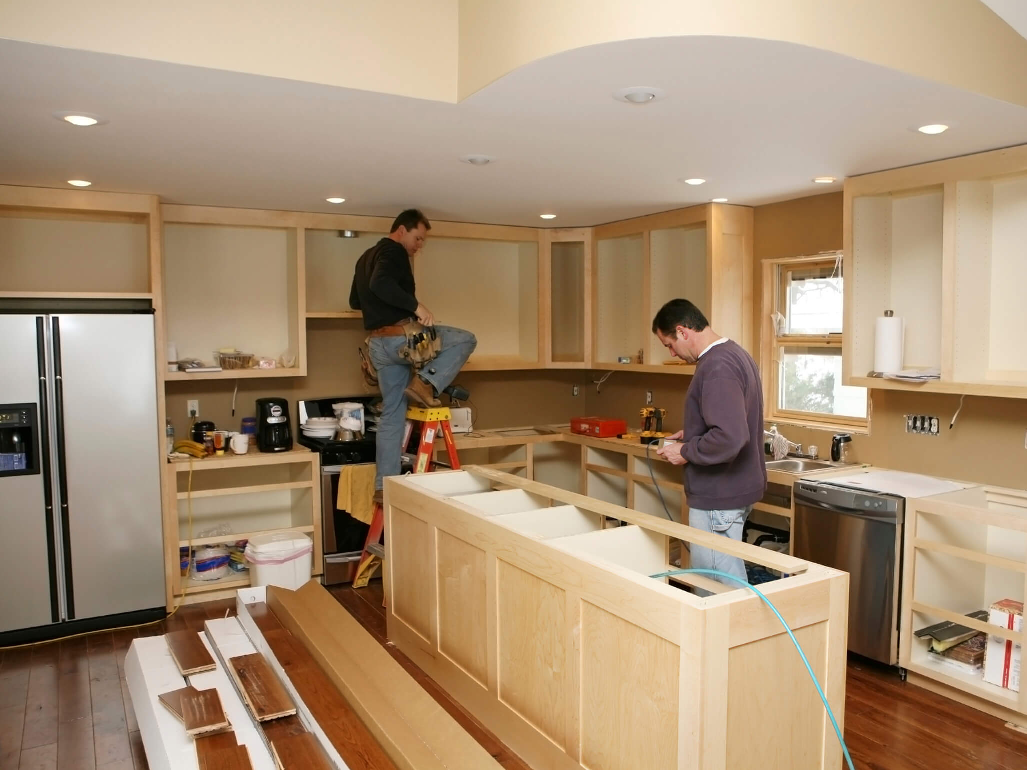 Washington home with contractors renovating kitchen